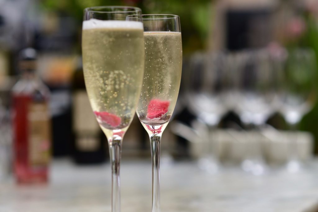 prosecco cocktail with rose petals at Petersham Nurseries